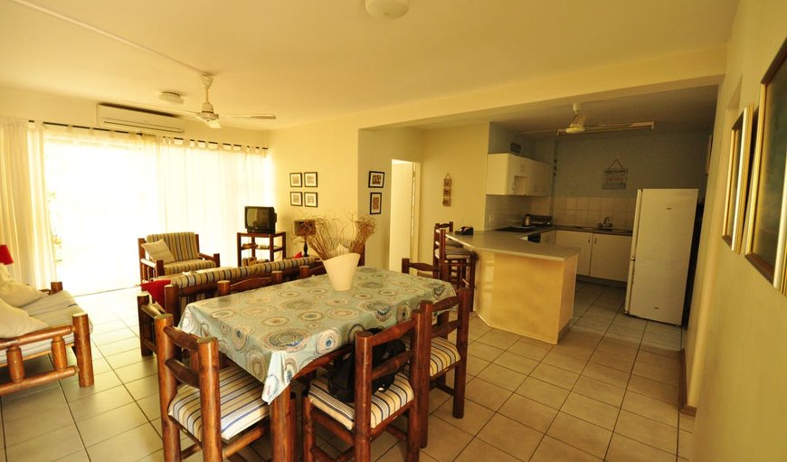 Open-plan lounge, dining area and kitchen. in St Lucia, KwaZulu-Natal, South Africa