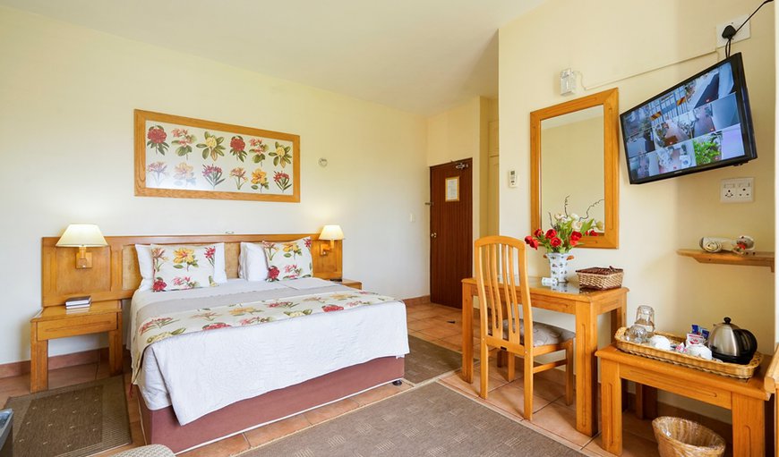 Double Room (3): Room en-suite, queen size bed & single bed. Air-conditioned  with tea coffee making facilities, hairdryers,  small bar fridge, electronic safes, TV (dstv) ,euro-outlets for charging cellphones /computers, comes complete  with guest amenities. 