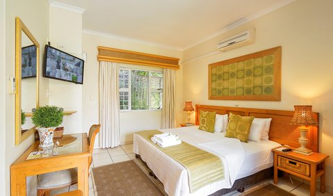 Twin or Double Room: Room en-suite, king size bed or 2 single beds. Air-conditioned with tea coffee making facilities, hairdryers, small bar fridge, electronic safes, TV (dstv) ,euro-outlets for charging cellphones /computers, comes complete  with guest amenities.