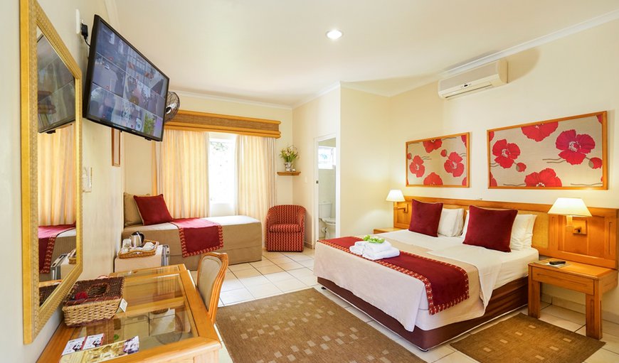 Room en-suite, queen size bed & single bed. Air-conditioned with tea coffee making facilities, hairdryers, small bar fridge, electronic safes, TV (dstv) ,euro-outlets for charging cellphones /computers, comes complete with guest amenities. Room en-suite, queen size bed & single bed. Air-conditioned with tea coffee making facilities, hairdryers, small bar fridge, electronic safes, TV (dstv) ,euro-outlets for charging cellphones /computers, comes complete with guest amenities.