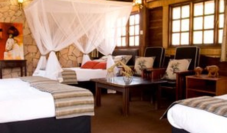 Double/Twin Chalets: thatched wooden tree houses, all en-suite, with comfortable beds, glass-free windows and electric blankets in winter.
