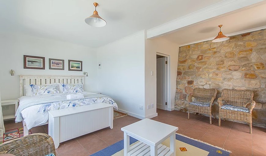 Modern Beach Apartment in Kalk Bay: Modern Beach Apartments bedroom with king size bed.