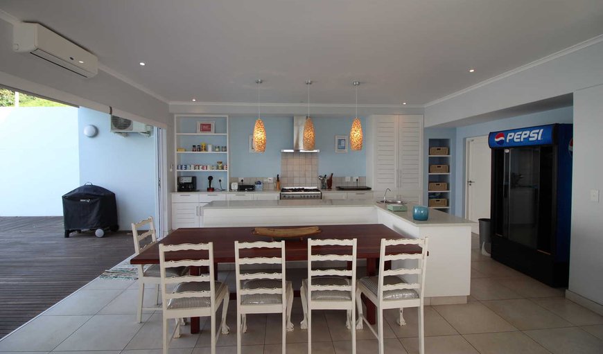 The open plan kitchen is equipped with a fridge/freezer, microwave, hob and oven, cutlery and crockery. The open plan kitchen is equipped with a fridge/freezer, microwave, hob and oven, cutlery and crockery.