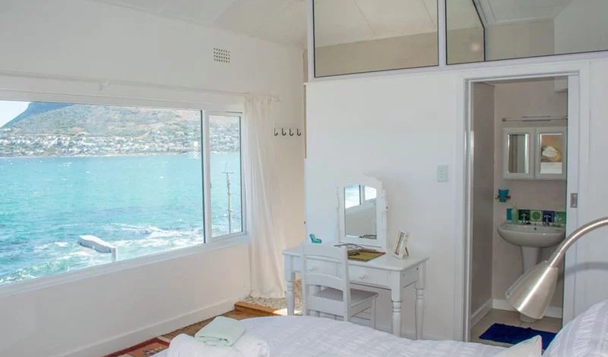 The Baytree Beach House in kalk Bay: The Baytree Beach House bedroom with double bed and sea view.