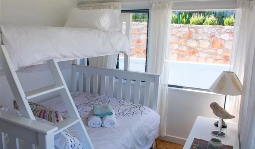 The Baytree Beach House in kalk Bay: The Baytree Beach house bedroom with bunk beds.