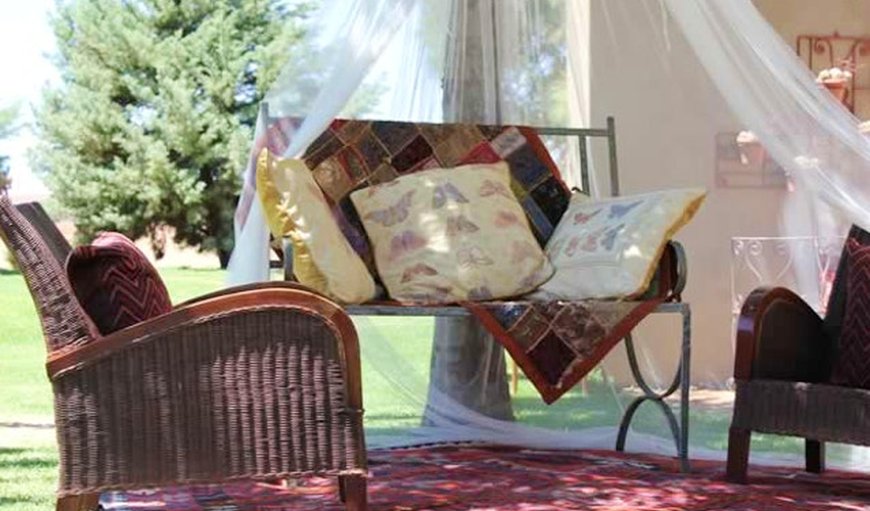 Equistay Equistrian Farm Retreat outside seating area with net cover.