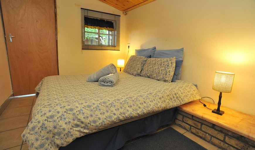 Double Chalets: Bedroom with a double bed.