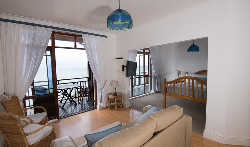 Apartment with a queen size bed and French, stained glass doors opening to the balcony with sounds and the smell of the ocean. in Fish Hoek, Cape Town, Western Cape, South Africa