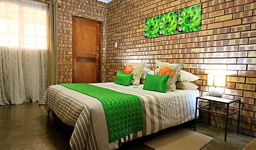 Double Room: Bietjie Moeg green bedroom.