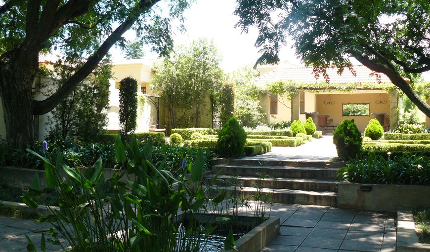 The entrance to the hotel and its beautiful gardens