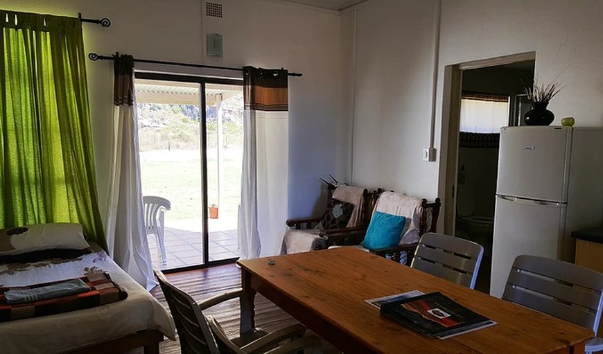 Unit 1 living area with sliding doors leading to the stoep/patio