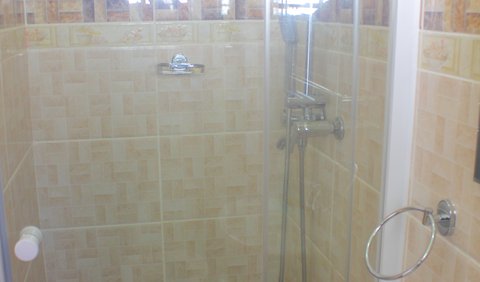Room 3: Chiloto Guest House bathroom with shower.