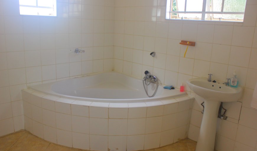 Room 2: Chiloto Guest House bathroom with bath tub.