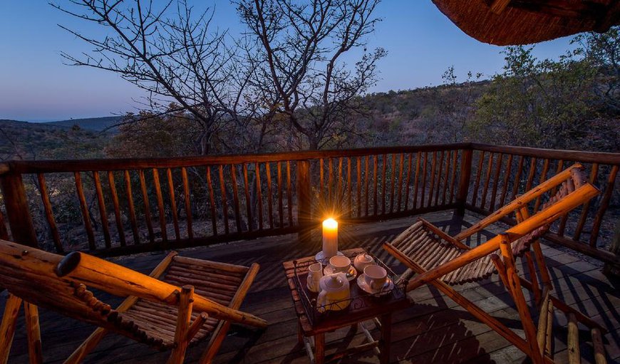 Luxury Room: Unwind in the comfort of a double room with bathroom en-suite, indoor and private outdoor shower, a secluded balcony area with breathtaking African views.