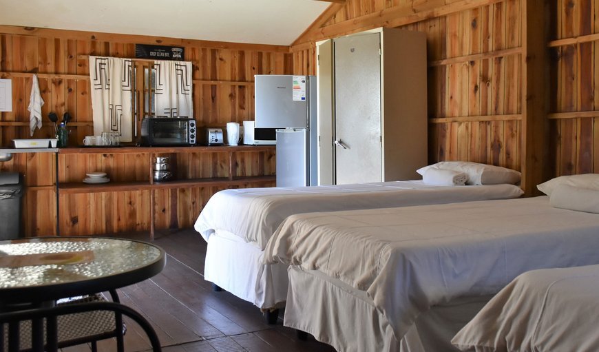 Standard Chalet: Pleasant Waters Standard Chalet beds and kitchenette