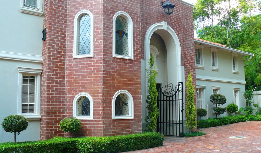 Lead glass windows and a generously sized wooden staircase add to the ambiance.