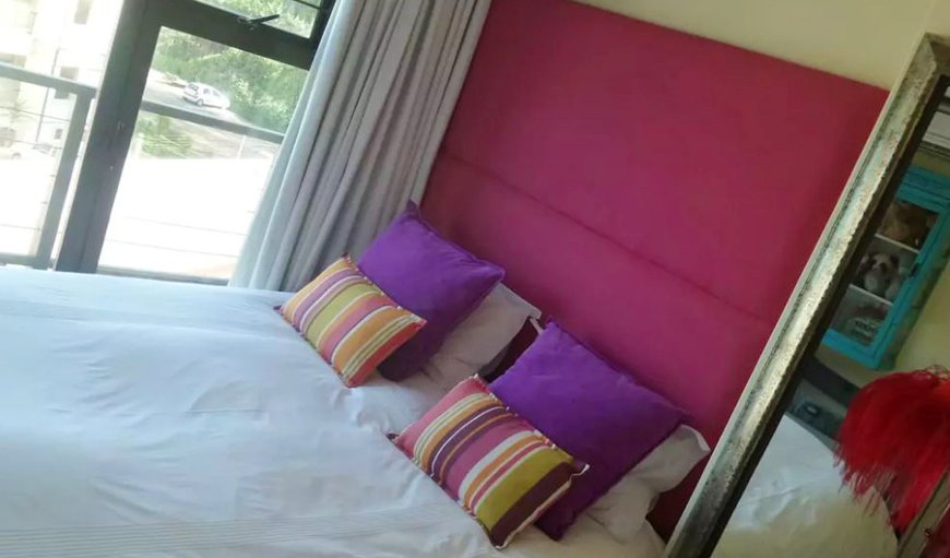 Bedroom 2 with queen size bed and glass doors that open up completely to the wooden deck overlooking the beach, jacuzzi and garden area. Bedroom 2 with queen size bed and glass doors that open up completely to the wooden deck overlooking the beach, jacuzzi and garden area.