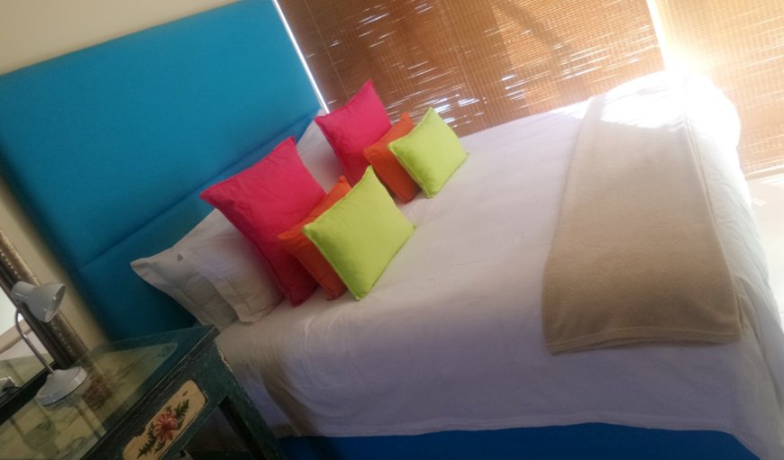 Bedroom 1 with king size bed and glass doors that open up completely to the wooden deck overlooking the beach, jacuzzi and garden area. Bedroom 1 with king size bed and glass doors that open up completely to the wooden deck overlooking the beach, jacuzzi and garden area.