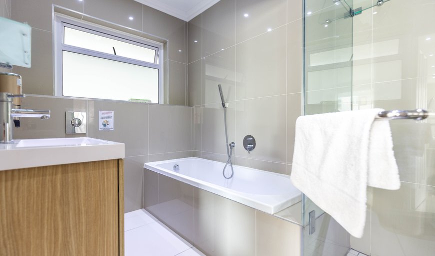 Three Bedroom Superior Apartment: Bathroom with a shower and bath