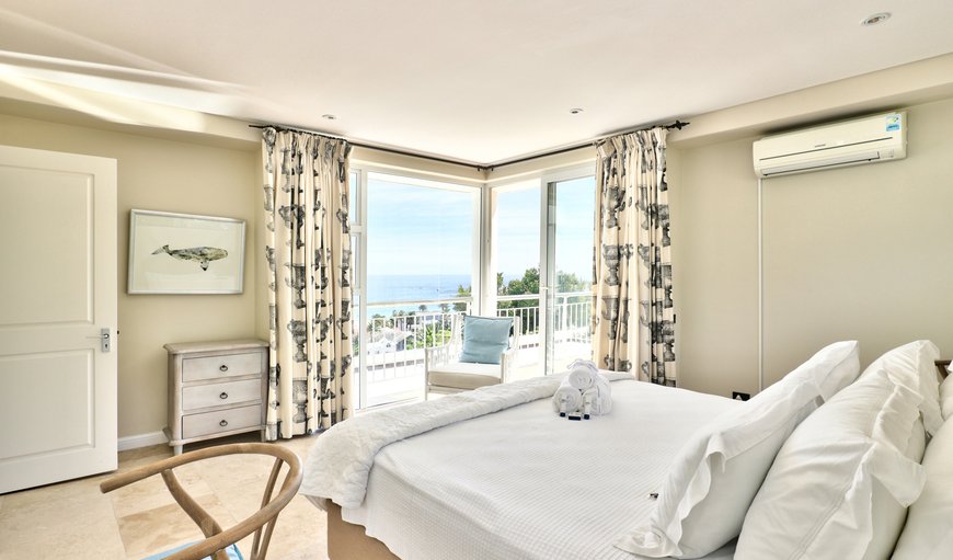 The third bedroom is furnished with a double bed and has a small balcony and an en-suite bathroom with a bath and shower. The third bedroom is furnished with a double bed and has a small balcony and an en-suite bathroom with a bath and shower.