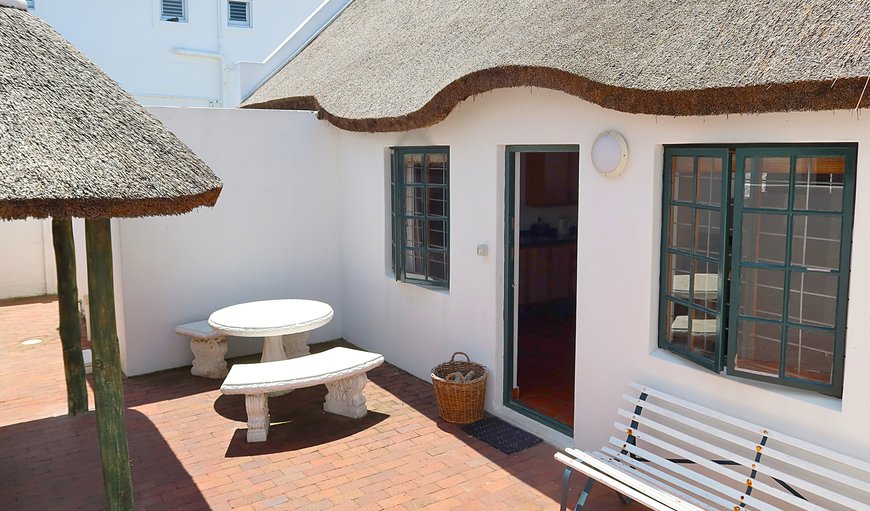 The comfortable 4B cottage has an enclosed courtyard and seating area in Arniston, Western Cape, South Africa