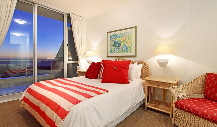 Dolphin Beach H104: The main bedroom is furnished with a queen size bed, an en-suite bathroom and sliding doors leading out onto the balcony.
