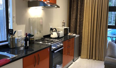 Orange Suite: Orange suite kitchen.