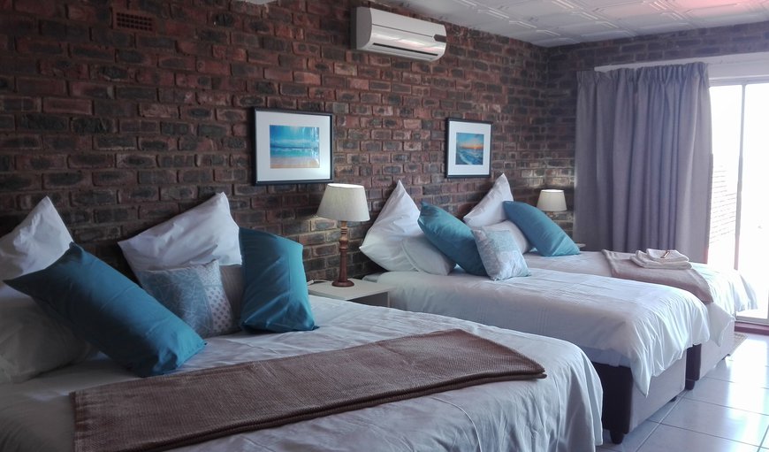 Ocean View family sleeper room has a king-size bed and 2 single beds. The room is also equipped with a Fridge, a TV with full DSTV channels, Hairdryer, Air-Con and Tea- and Coffee-making facilties. Ocean View family sleeper room has a king-size bed and 2 single beds. The room is also equipped with a Fridge, a TV with full DSTV channels, Hairdryer, Air-Con and Tea- and Coffee-making facilties.