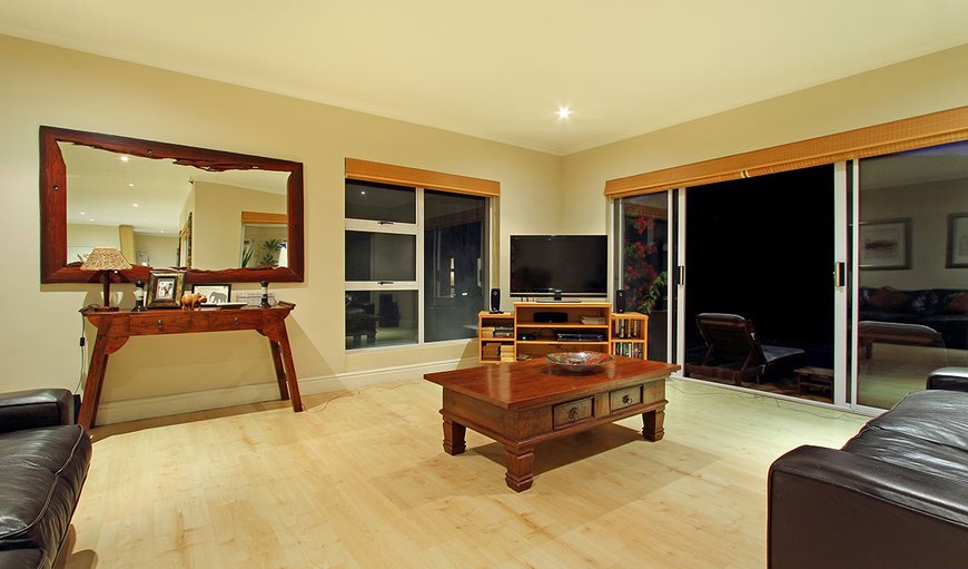 The spacious open plan lounge area is tastefully furnished and contains a plasma TV complemented by DSTV and DVD player. The spacious open plan lounge area is tastefully furnished and contains a plasma TV complemented by DSTV and DVD player.