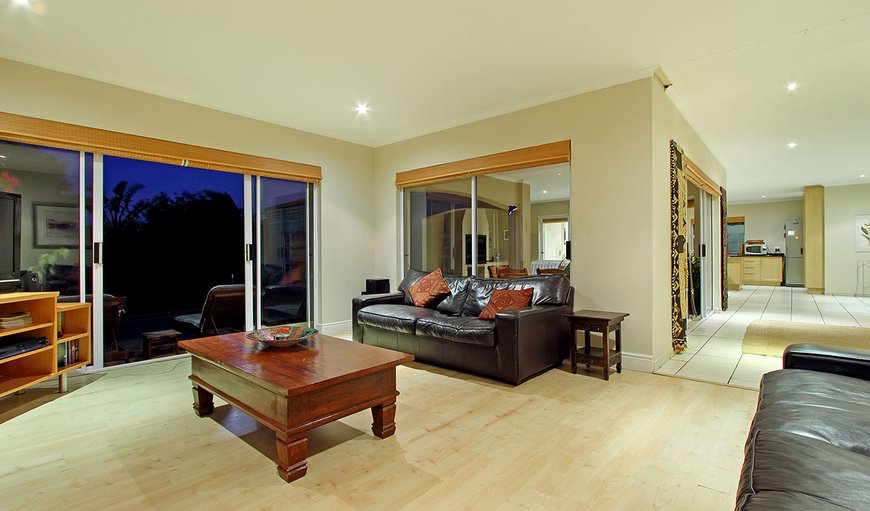 The spacious open plan lounge area is tastefully furnished and contains a plasma TV complemented by DSTV and DVD player. The spacious open plan lounge area is tastefully furnished and contains a plasma TV complemented by DSTV and DVD player.