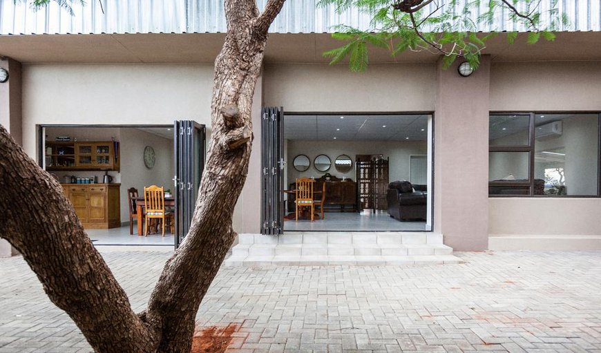 The outdoor patio with views to the kitchen & dining area