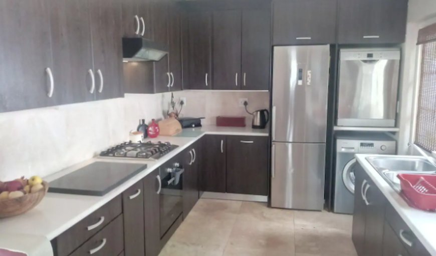 A Few Blocks Away: Fully equipped kitchen with dishwasher and fridge/stove/oven