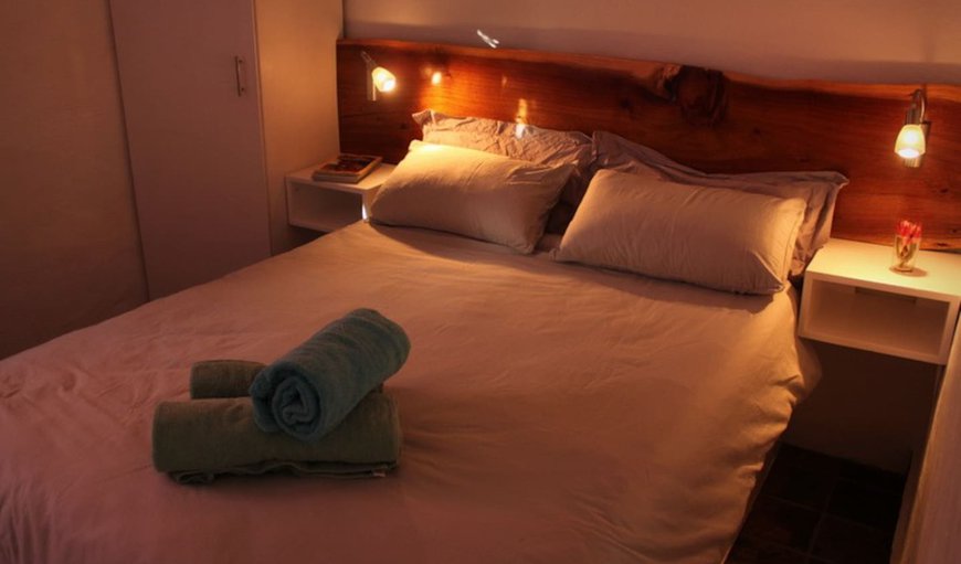 A comfortable double bed with night lights and hanging/shelved space for clothing. Power plugs available at each bed for device charging. A comfortable double bed with night lights and hanging/shelved space for clothing. Power plugs available at each bed for device charging.