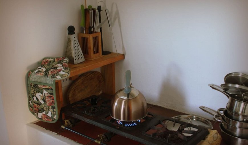 The kitchen is well equipped with a gas stove top and fridge. All needed utensils and pots to cook a great meal. The kitchen is well equipped with a gas stove top and fridge. All needed utensils and pots to cook a great meal.
