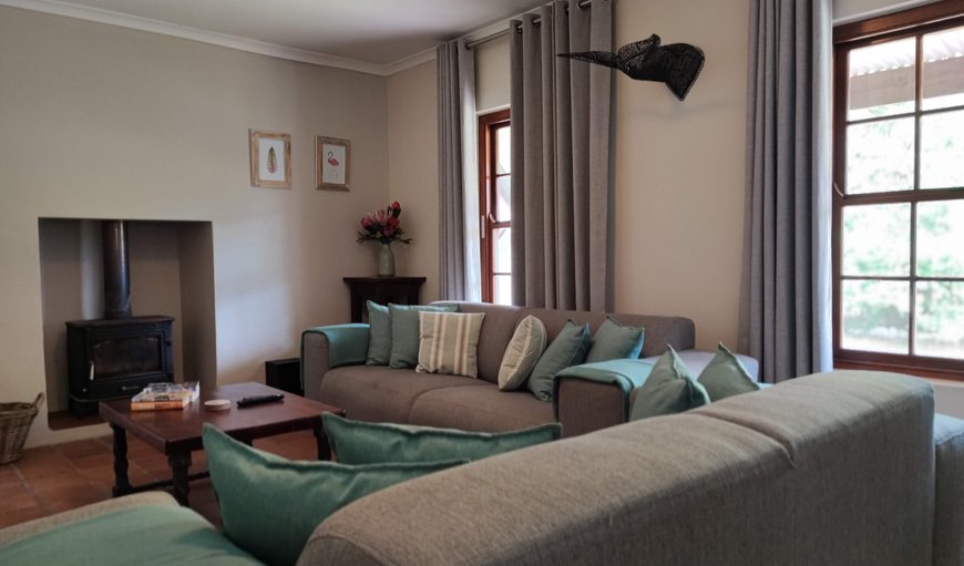 From the Lounge you can look directly onto the Garden via the Stoep (Verandah) that runs the length of the House. From the Lounge you can look directly onto the Garden via the Stoep (Verandah) that runs the length of the House.