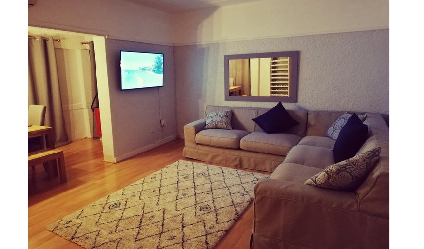 Lounge with comfortable seating and flat screen TV