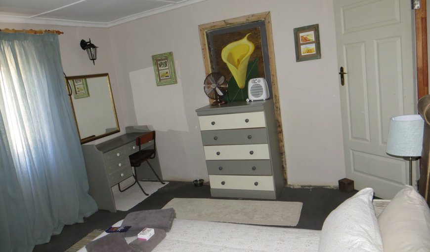 The first bedroom is comfortably furnished with a queen size bed and a dresser and has an en-suite bathroom. The first bedroom is comfortably furnished with a queen size bed and a dresser and has an en-suite bathroom.