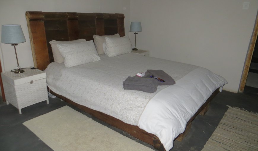 The first bedroom is comfortably furnished with a queen size bed and a dresser and has an en-suite bathroom. The first bedroom is comfortably furnished with a queen size bed and a dresser and has an en-suite bathroom.
