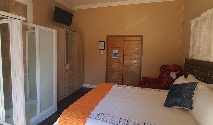 Block A - Room 3 Queen Bed: Block A Room 3 Queen Bed - This room contains a queen size bed, a TV with DSTV, a bar fridge and an en-suite bathroom