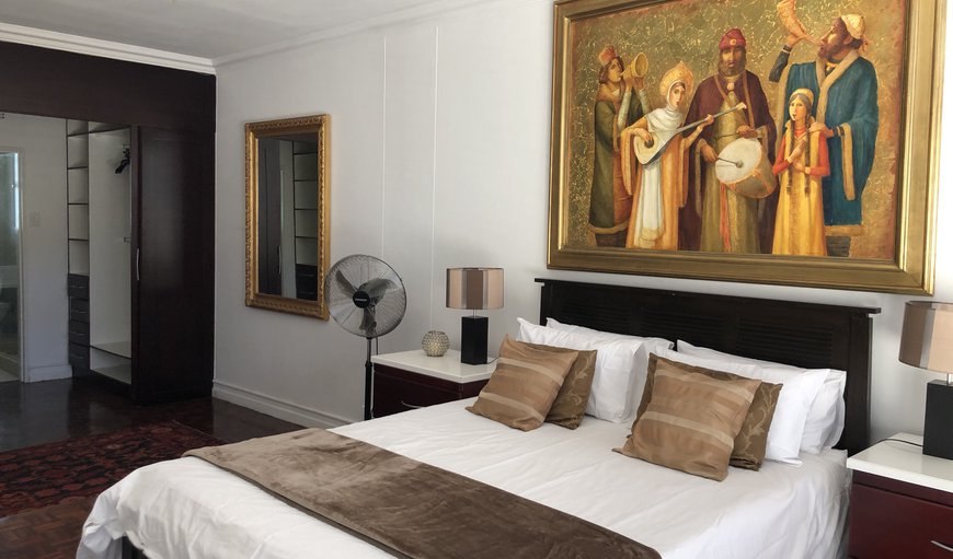 Luxury Sandton Living at 102 Kambula: The main bedroom is furnished with a king size bed and has an en-suite bathroom