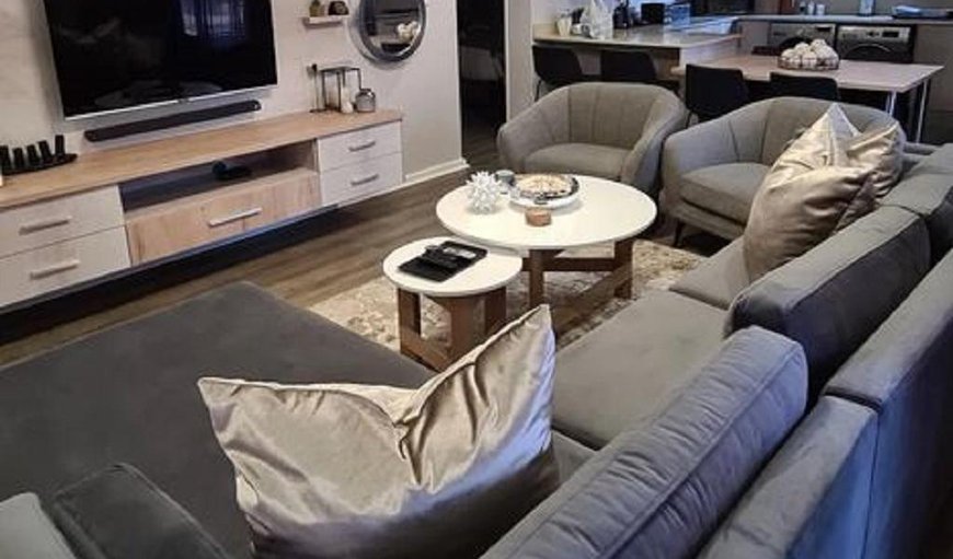Villa Casa 15 - The lounge area is tastefully furnished with a comfortable couch and a flat screen TV Villa Casa 15 - The lounge area is tastefully furnished with a comfortable couch and a flat screen TV