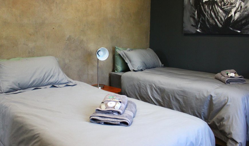 Blouwildebees Uitsig - Two of the bedrooms are each furnished with 2 three quarter beds, while the other two each contain 2 single beds Blouwildebees Uitsig - Two of the bedrooms are each furnished with 2 three quarter beds, while the other two each contain 2 single beds