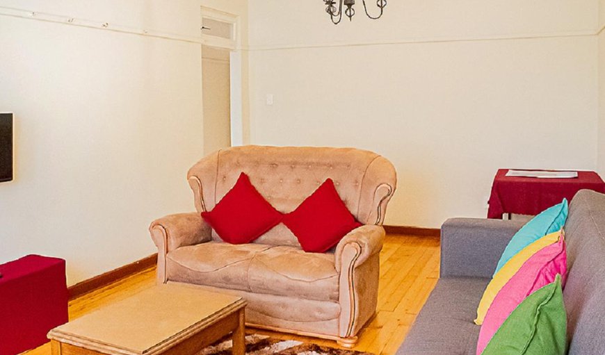 Unit Four: Unit 4 - The lounge area is furnished with comfortable couches and a TV