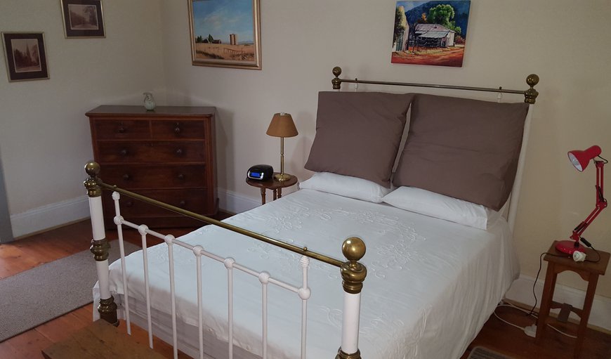 Rustic & Regal: The main bedroom is furnished with a comfortable double bed
