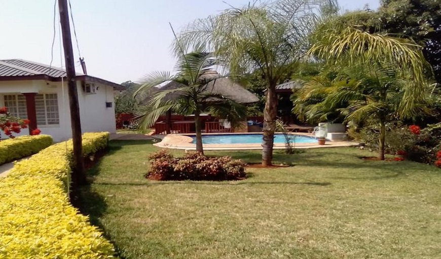 R.S Garden features an outdoor swimming pool and a garden
