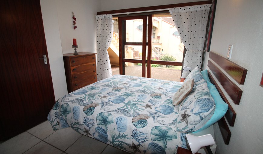 Uvongo Cabanas 03B: The first bedroom is furnished with a double bed