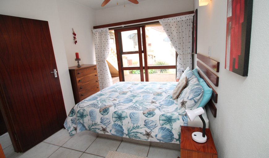 Uvongo Cabanas 03B: The first bedroom is furnished with a double bed