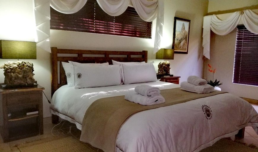 Paws Five: Paws Five - This bedroom is furnished with a king size bed