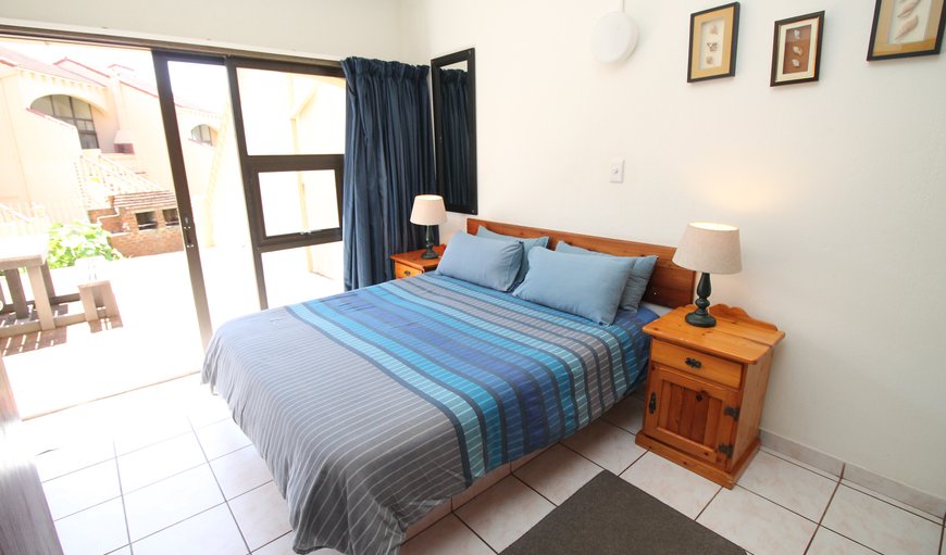 Uvongo Cabanas 04B: Bedroom with a queen size bed