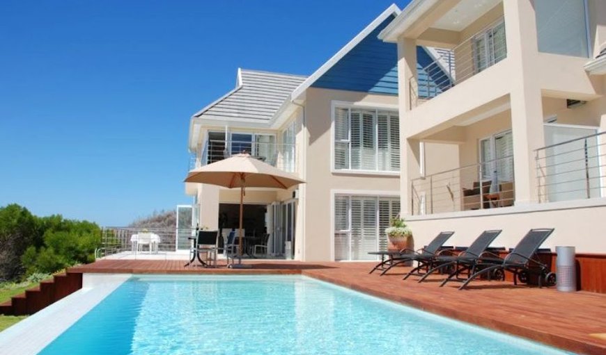 The Beach house has a beautiful large swimming pool and stunning sea views